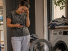 homeowner dealing with broken washing machine and disrupted household routine