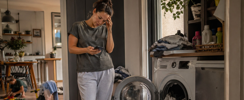 homeowner dealing with broken washing machine and disrupted household routine