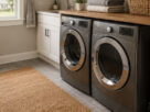 Bright, modern Atlanta laundry room with front-load washer and dryer, folding countertop, open shelving, hanging clothes, and water-resistant flooring.